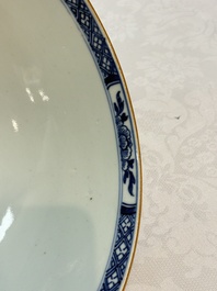 A Chinese blue and white punch bowl with a lady and two boys in a garden, Qianlong