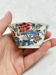 A Chinese famille rose 'roosters' covered teapot and two cups and saucers, Yongzheng