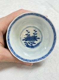 A set of four Chinese blue and white cups and saucers, flower mark, 19th C.