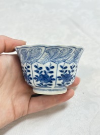 A set of four Chinese blue and white cups and saucers, flower mark, 19th C.