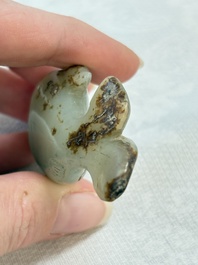 Two Chinese celadon, white and russet jade carvings, 18/19th C.