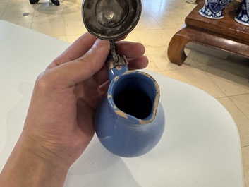 A very rare blue-glazed Dutch Delft jug with a mounted silver cover, 18th C.