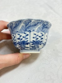 A set of four Chinese blue and white cups and saucers, flower mark, 19th C.