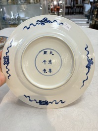 A Dutch-decorated Chinese plate, an Imari-verte dish and a blue and white dish, Kangxi/Yongzheng