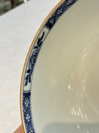 A Chinese blue and white punch bowl with a lady and two boys in a garden, Qianlong