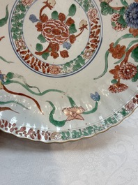 A Dutch-decorated Chinese plate, an Imari-verte dish and a blue and white dish, Kangxi/Yongzheng