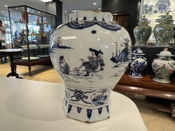 A blue, white and manganese Dutch Delft chinoiserie vase and cover, ca. 1700