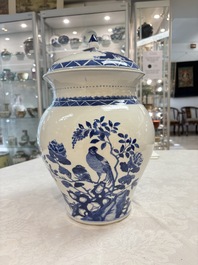 A Chinese blue and white 'birds among flowering branches' vase and cover, 19th C.
