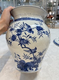 A Chinese blue and white 'birds among flowering branches' vase and cover, 19th C.
