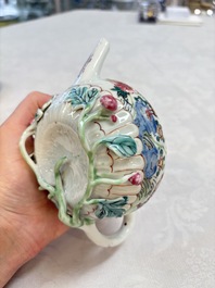 A Chinese famille rose 'roosters' covered teapot and two cups and saucers, Yongzheng