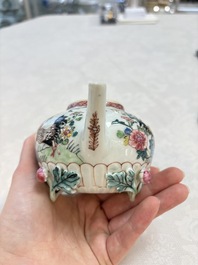 A Chinese famille rose 'roosters' covered teapot and two cups and saucers, Yongzheng