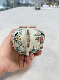 A Chinese famille rose 'roosters' covered teapot and two cups and saucers, Yongzheng