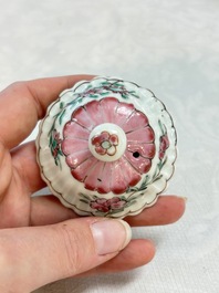 A Chinese famille rose 'roosters' covered teapot and two cups and saucers, Yongzheng