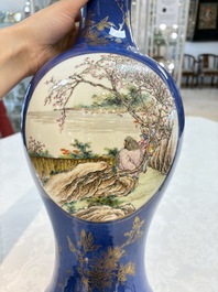 A Chinese famille rose powder-blue-ground vase, 19th C.