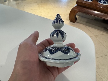A blue, white and manganese Dutch Delft chinoiserie vase and cover, ca. 1700