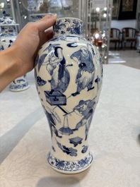 A Chinese blue and white garniture of four vases with figural design, Kangxi mark, 19th C.