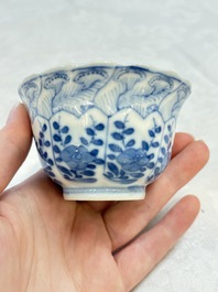 A set of four Chinese blue and white cups and saucers, flower mark, 19th C.