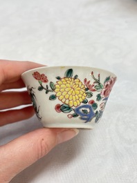 A Chinese famille rose 'roosters' covered teapot and two cups and saucers, Yongzheng