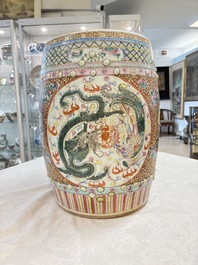 A pair of Chinese famille rose 'dragon and phoenix' garden seats, 19/20th C.