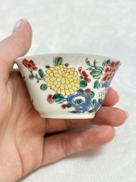 A Chinese famille rose 'roosters' covered teapot and two cups and saucers, Yongzheng