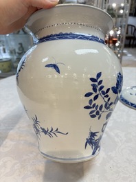 A Chinese blue and white 'birds among flowering branches' vase and cover, 19th C.