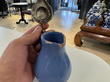 A very rare blue-glazed Dutch Delft jug with a mounted silver cover, 18th C.