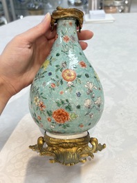 A Chinese wucai square covered container, a gilt bronze-mounted famille verte vase and a Canton famille verte bottle vase, Kangxi and later