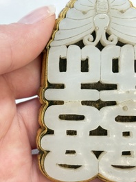 A Chinese gilt bronze-mounted white jade 'double happiness' belt buckle, 18th C.