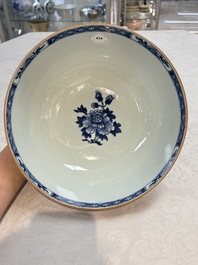 A Chinese blue and white punch bowl with a lady and two boys in a garden, Qianlong