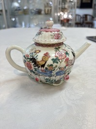 A Chinese famille rose 'roosters' covered teapot and two cups and saucers, Yongzheng