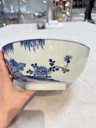 A Chinese blue and white punch bowl with a lady and two boys in a garden, Qianlong