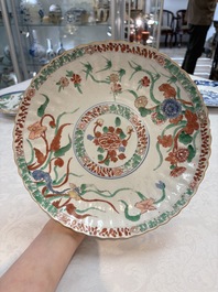 A Dutch-decorated Chinese plate, an Imari-verte dish and a blue and white dish, Kangxi/Yongzheng