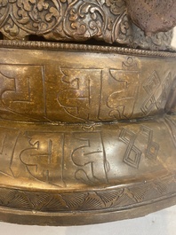 A Tibetan or Nepalese turquoise-inlaid partly-gilt bronze figure of White Tara, 20th C.