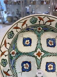 A polychrome Iznik pottery dish with stylised floral design, Turkey, ca. 1600