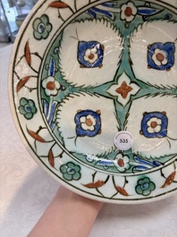 A polychrome Iznik pottery dish with stylised floral design, Turkey, ca. 1600