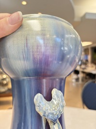 A Chinese flamb&eacute;-glazed garlic-mouth vase with ruyi handles, 19th C.