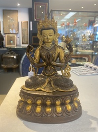 A Tibetan or Nepalese turquoise-inlaid partly-gilt bronze figure of White Tara, 20th C.