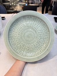 Three Chinese celadon-glazed plates with floral anhua design, 18/19th C.