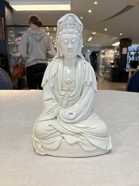 A Chinese white-glazed Guanyin, Kangxi mark, 19th C.