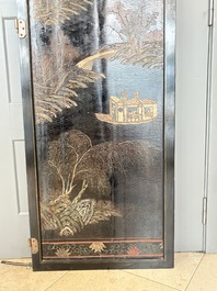 A Chinese Coromandel lacquered four-panel folding screen with mountainous landscapes, 17/18th C.