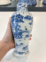 A Chinese blue and white garniture of five vases with landscape design, 19th C.