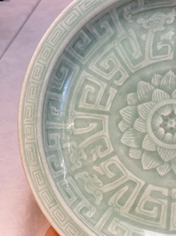 Three Chinese celadon-glazed plates with floral anhua design, 18/19th C.