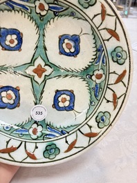 A polychrome Iznik pottery dish with stylised floral design, Turkey, ca. 1600