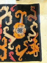 Two Tibetan woollen rugs with floral design, 19th C.