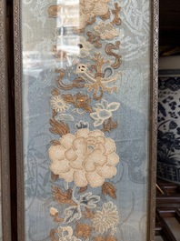 A fine Chinese kesi square 'dragon' panel and two silk embroideries with floral design, 19th C.