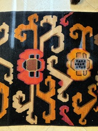 Two Tibetan woollen rugs with floral design, 19th C.