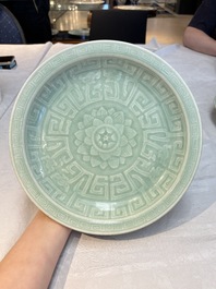 Three Chinese celadon-glazed plates with floral anhua design, 18/19th C.