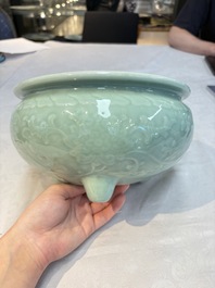 A Chinese celadon-glazed tripod censer with floral anhua design, 18/19th C.