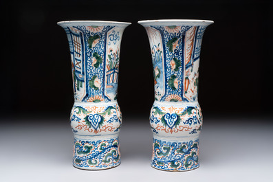 A pair of unusual polychrome Dutch Delft Kangxi-style chinoiserie beaker vases, early 18th C.
