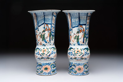 A pair of unusual polychrome Dutch Delft Kangxi-style chinoiserie beaker vases, early 18th C.